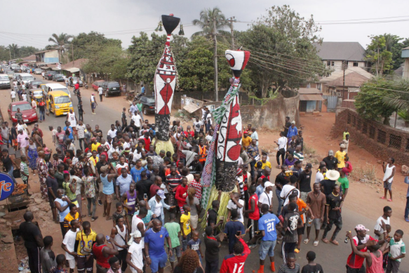 A procession scene featuring two Odo masquerades. [photo from www.gogeafrica.tv]