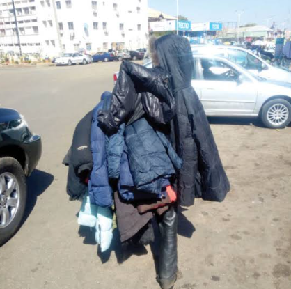 Person selling jackets, source unknown